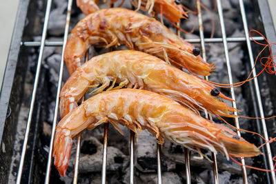 Close-up of fish on barbecue grill