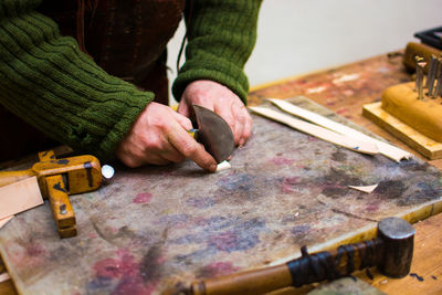 Cropped image of man working in workshop