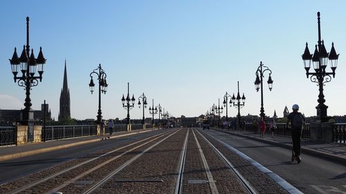 Railroad tracks against clear sky