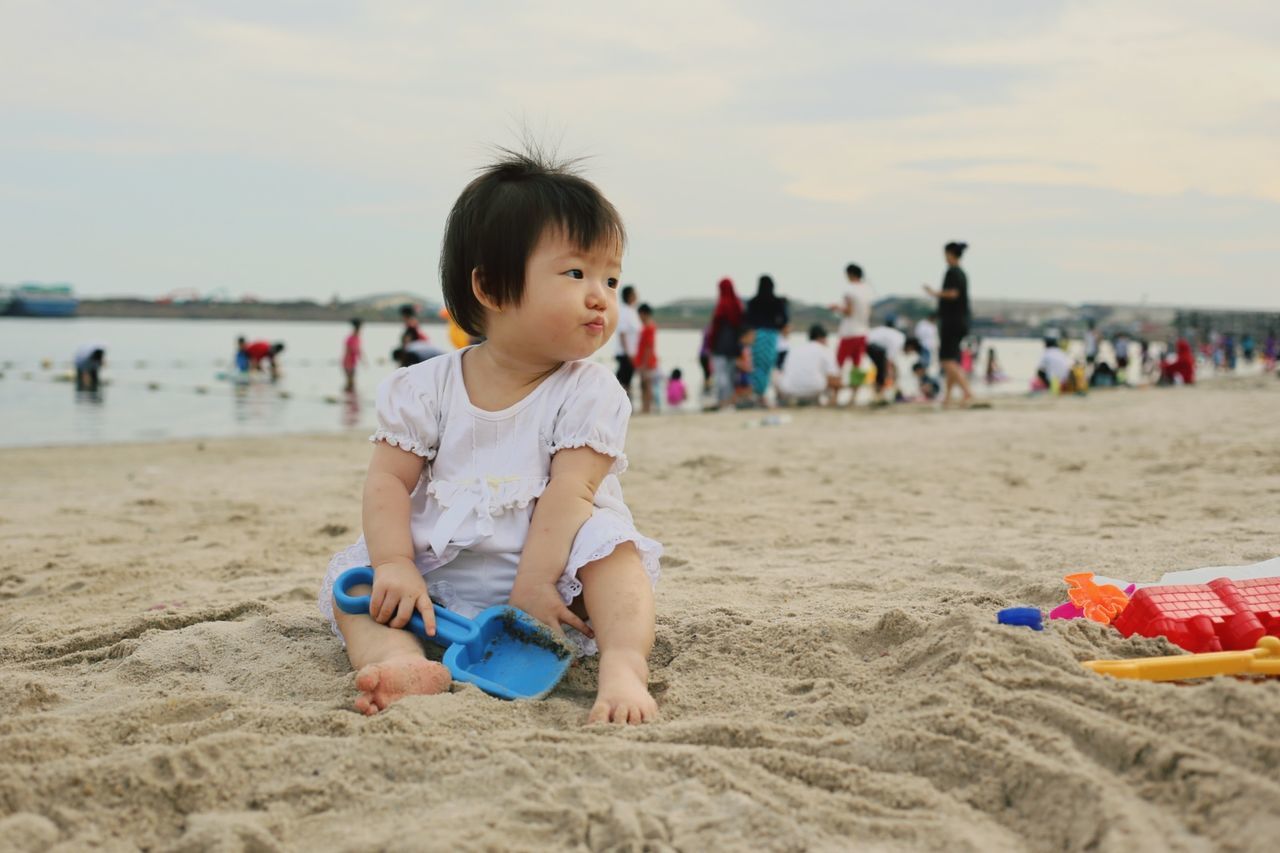 beach, sand, childhood, leisure activity, lifestyles, shore, vacations, girls, elementary age, boys, enjoyment, fun, focus on foreground, sea, person, playing, happiness, innocence, playful