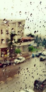 Full frame shot of wet glass window in rainy season