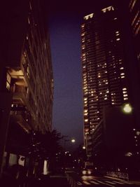 Low angle view of modern building at night