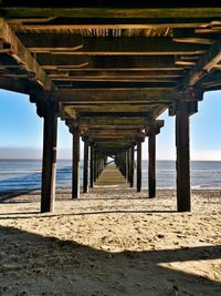 Pier over sea against sky