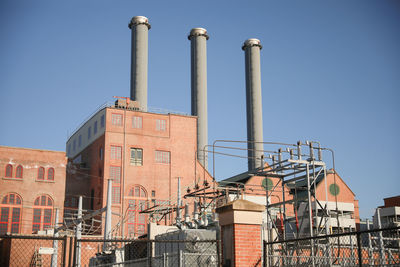 Low angle view of buildings against clear sky