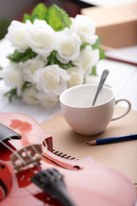 Close-up of white roses on table