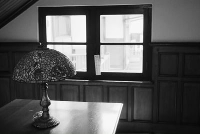 Close-up of illuminated lamp hanging on table