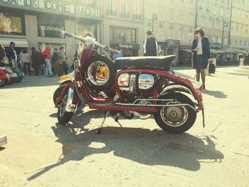 People on motorcycle in city