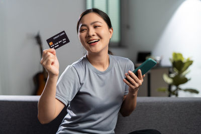 Young woman using mobile phone