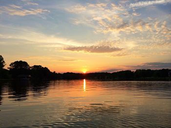 Scenic view of lake at sunset