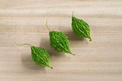 Close-up of green chili pepper on table