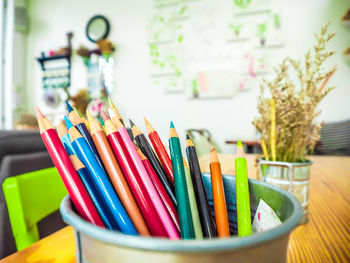 Close-up of colored pencils on table