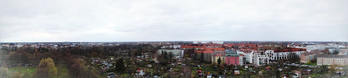 High angle view of modern buildings in city against sky