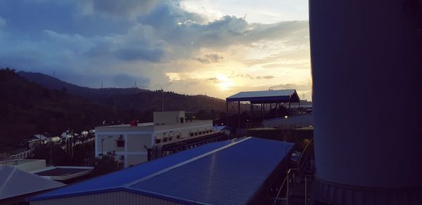 High angle view of buildings against sky at sunset