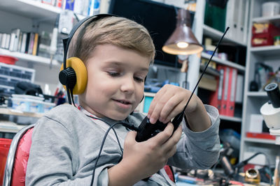 Boy wearing headphones at home