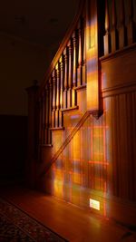 Light from stained glass window on staircase indoors