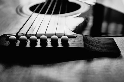 Close-up of guitar playing on table