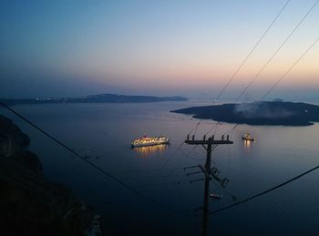 Boats in sea at sunset, greece