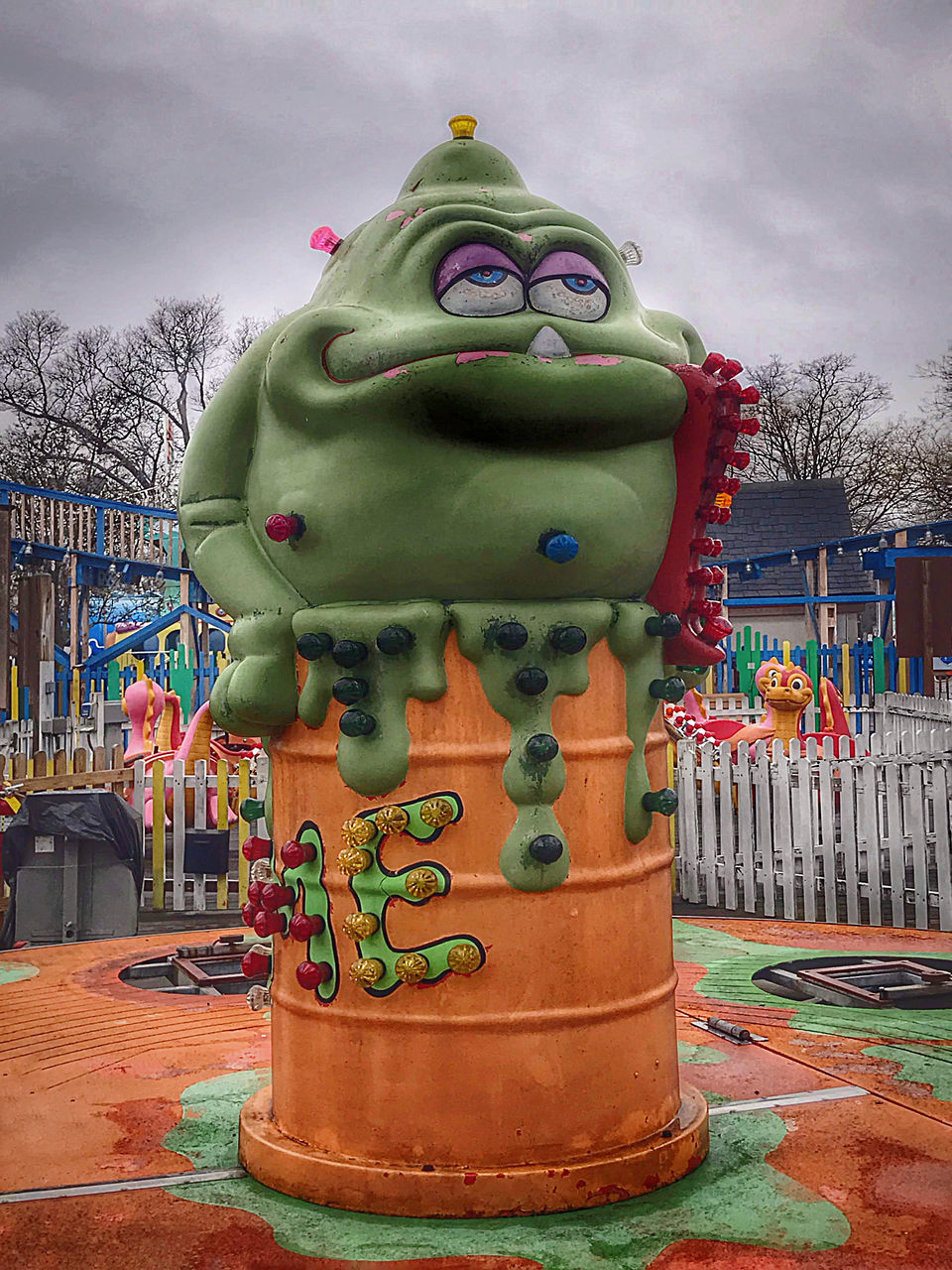 cloud, sky, architecture, park, sculpture, amusement park, multi colored, nature, no people, statue, representation, tree, art, animal representation, craft, outdoors, creativity, plant, city, day