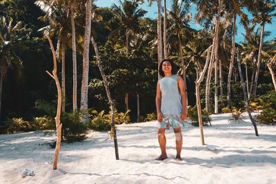 Full length portrait of man standing in swimming pool