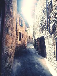 Street amidst buildings against sky