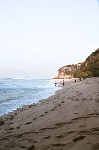 Scenic view of beach against clear sky