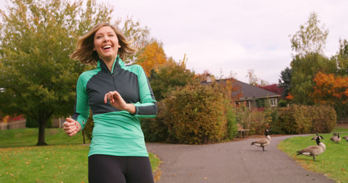 Portrait of smiling woman in park