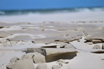 Surface level of beach against sky