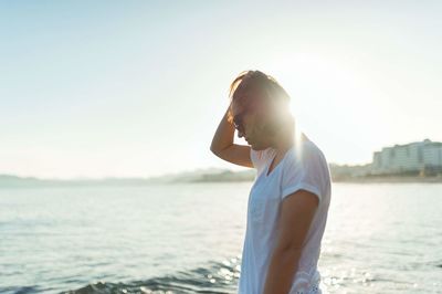 Woman standing on beach