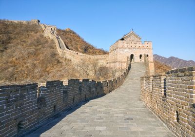 View of the great wall of china going up a mountain