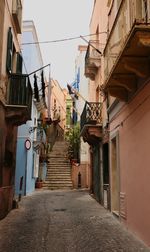 Narrow alley amidst buildings in city