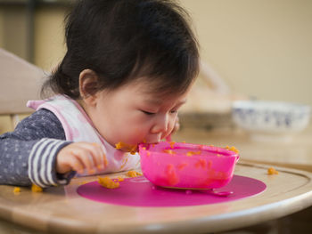 Close-up of cute girl eating