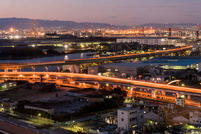 High angle view of illuminated cityscape at night