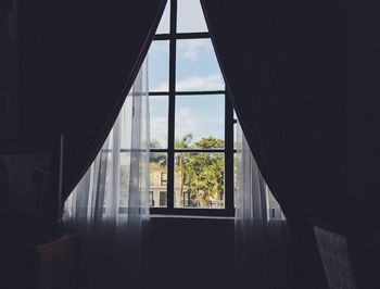 View of trees seen through window