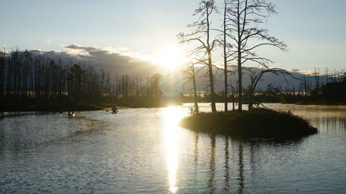 Scenic view of lake against sky during sunset