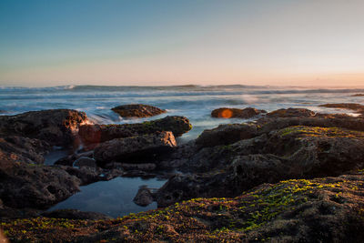 Scenic view of sea against sky during sunset