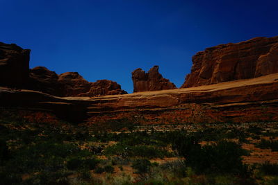 Scenic view of rocky mountains against clear sky