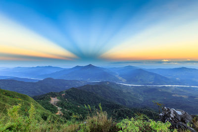 Scenic view of mountains against sky during sunset