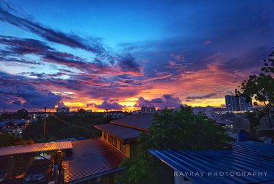 High angle view of illuminated buildings against sky at sunset