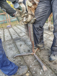 Low section of man working on floor