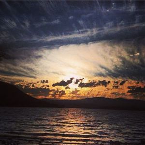 Scenic view of sea against cloudy sky