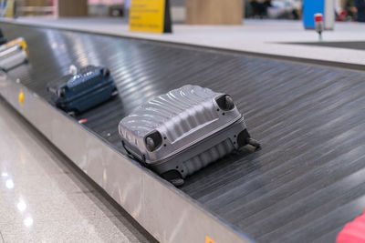 Close-up of luggage on conveyor belt in airport