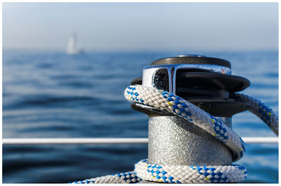 Close-up of rope tied to pier