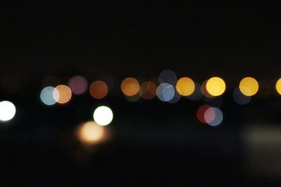 Defocused image of illuminated lights at night