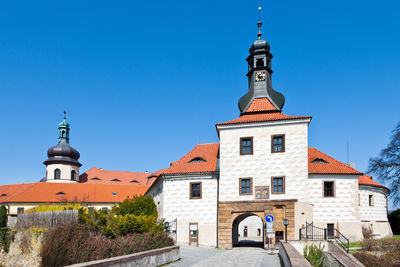 View of buildings against blue sky