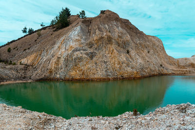 Scenic view of rock formation against sky