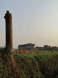 Built structure on field against clear sky