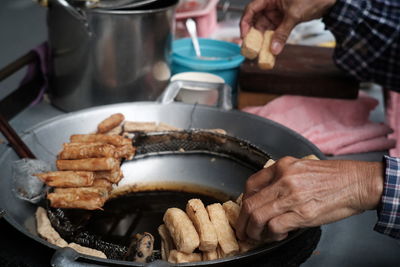 Cropped image of man preparing food