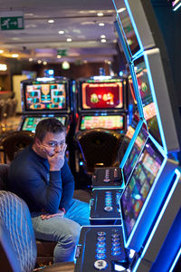 Depressed man sitting in casino