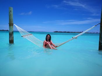 Portrait of young woman in sea