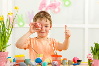 Portrait of boy playing with toys on table